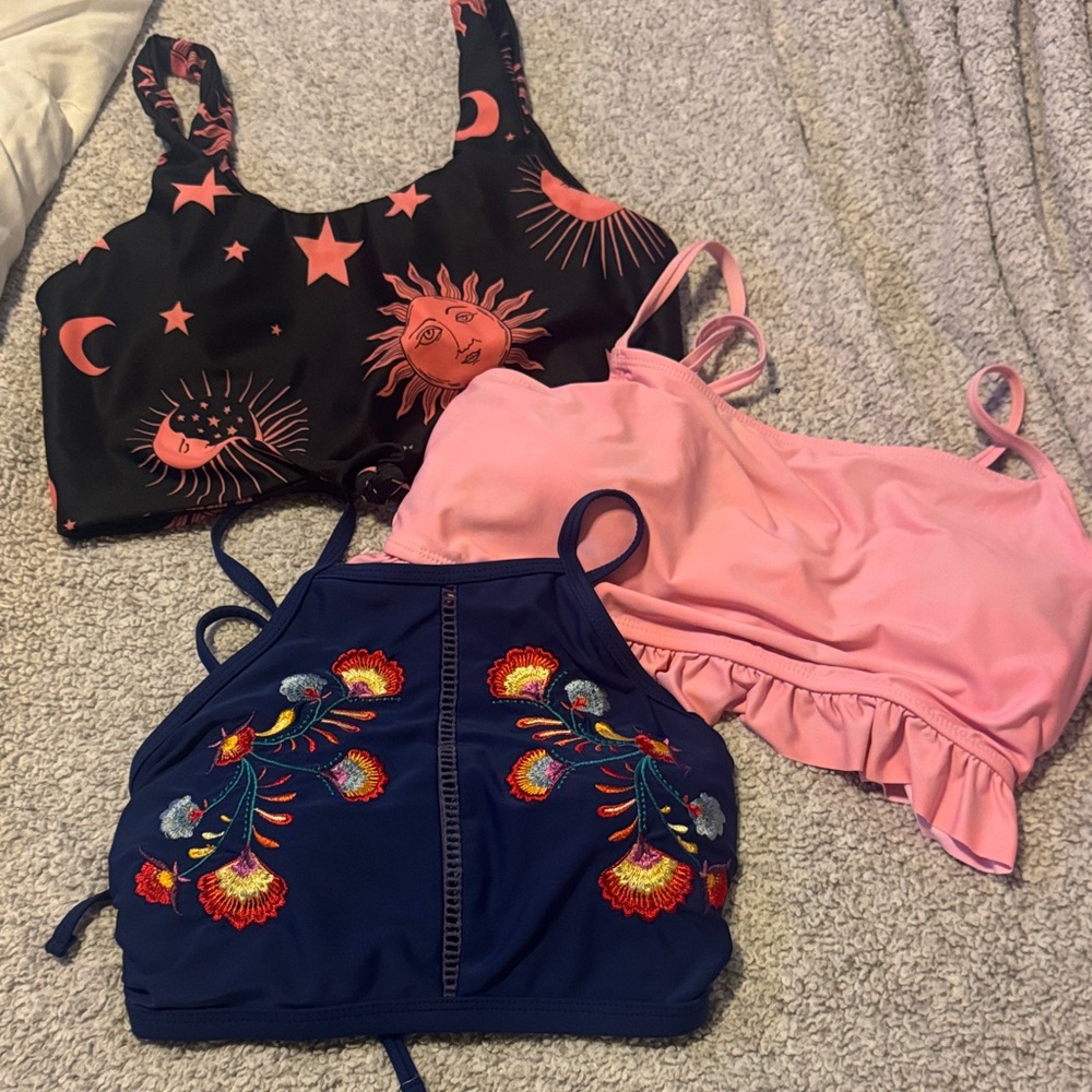 Trio of Swimsuit Tops in Black, Pink, and Blue